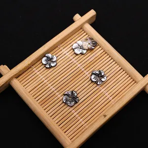 Natural black mother of pearl shell beads in flower shape with iridescent luster for DIY