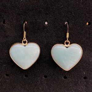 Natural heart-shaped turquoise drop earrings with gold plated edges and hooks