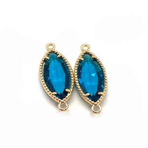Dunkelblauer Reisförmiger Edelstein-Verbinder mit goldener Krallenfassung und Ringen