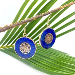 Lapis lazuli round drop earrings with gold butterfly pattern on wooden branch