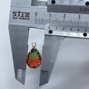 Detail view of faceted crystal water drop pendant showing 13mm width measurement