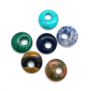 Assorted natural stone donut beads including tiger eye and turquoise for DIY jewelry