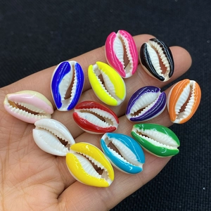 Detailed view of colorful seashell beads in various vibrant colors for jewelry making