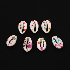 Natural shell beads with floral patterns and inspirational words for DIY necklaces