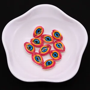 Macro view of evil eye printed natural conch shell beads for DIY jewelry making