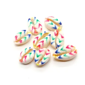 Macro shot of colorful painted cowrie shells with zigzag patterns for DIY jewelry