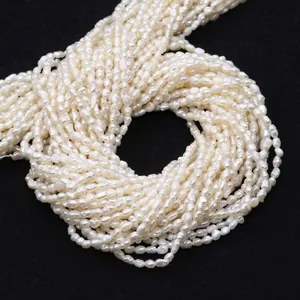 Detailed view of white freshwater rice pearls on strings for DIY jewelry making projects