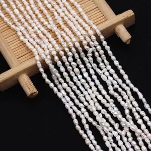 Macro detail of high-luster white freshwater tiny pearls on a textured bamboo board