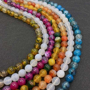 Macro detail of mixed colorful dragon vein agate round beads for DIY jewelry making