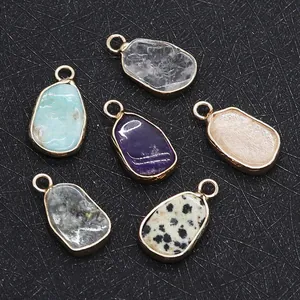 Set of six irregular teardrop natural stone pendants with gold plated metal edging details