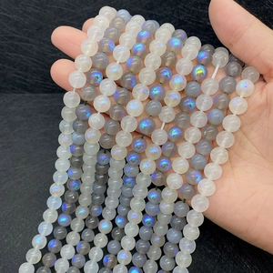 Macro detail of natural labradorite beads with brilliant blue iridescent flashes for DIY