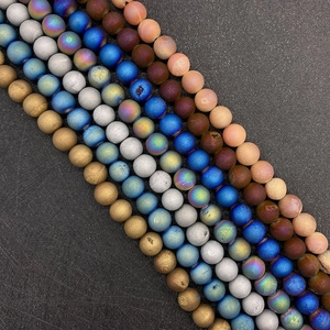 Macro shot of matte frosted natural agate beads in various metallic colors for DIY jewelry