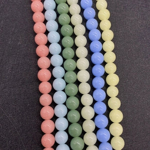 Close-up of colorful 6-10mm natural round beads for DIY jewelry making and necklaces