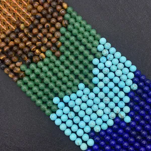 Macro shot of assorted 6mm to 10mm natural tiger eye and turquoise beads for DIY jewelry