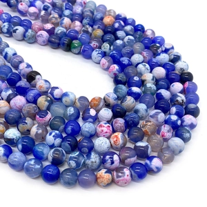 Macro detail of blue and purple dragon vein agate beads with unique marbled textures