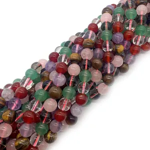Detailed view of polished natural crystal beads featuring tiger eye and agate stones