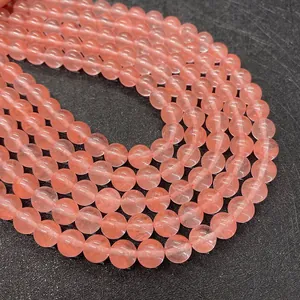 Macro detail of natural pink watermelon crystal beads with smooth polished finish