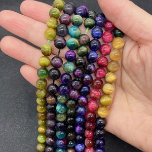Macro detail of mixed color tiger eye stone beads with cat eye effect for DIY jewelry