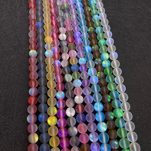 Macro detail of matte synthetic moonstone beads with aurora shimmer for DIY jewelry