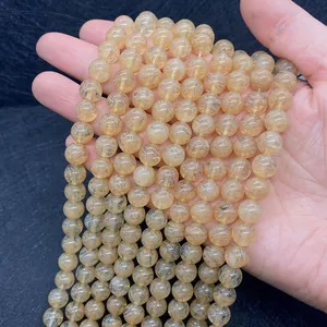 Macro detail of natural yellow sunstone beads showing semi-transparent mineral textures