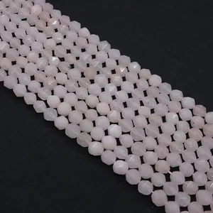 Macro shot of faceted natural rose quartz beads with translucent texture for jewelry DIY