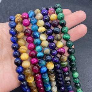 Macro shot of colorful tiger eye stone beads in vibrant shades for DIY jewelry making