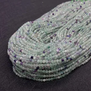 Macro detail of faceted green and purple fluorite stone beads for DIY jewelry making