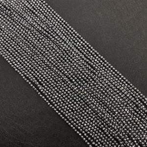 Macro view of 2-4mm faceted hematite beads with high metallic gloss for DIY jewelry