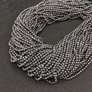 Macro view of faceted hematite beads for DIY jewelry with metallic gloss texture