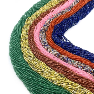 Macro shot of 2-4mm faceted natural stone beads in various colors for jewelry DIY