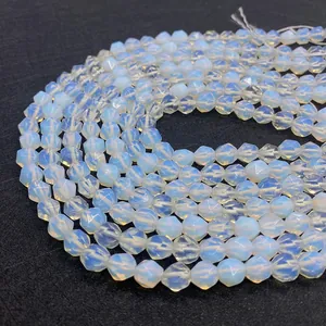 Macro shot of faceted opalite beads showing translucent milky white and blue iridescence