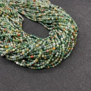 Macro detail of faceted Indian Agate beads showing green natural stone texture for DIY jewelry