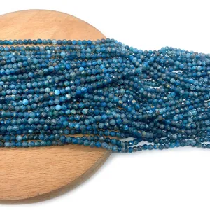 Faceted blue apatite natural stone beads for DIY jewelry making on wood display
