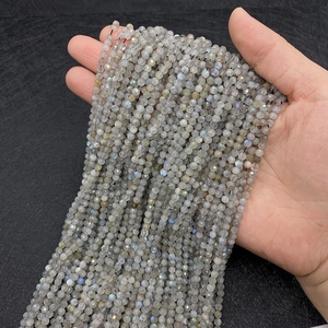Macro shot of 2-3mm faceted natural labradorite beads with brilliant blue labradorescence