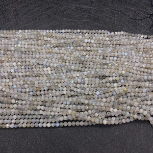 Macro view of 2-4mm faceted labradorite beads with natural blue and yellow fire sheen