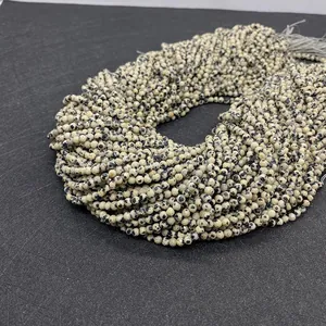 Macro detail of faceted Dalmatian Jasper stone beads for DIY jewelry making