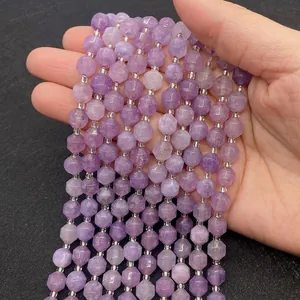 Macro detail of faceted lavender amethyst beads with silver spacers for DIY jewelry