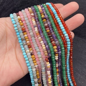 Macro shot of 2-4mm faceted natural stone beads including amethyst and rose quartz