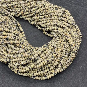 Macro shot of natural 2x3mm faceted dalmatian jasper beads for DIY jewelry making