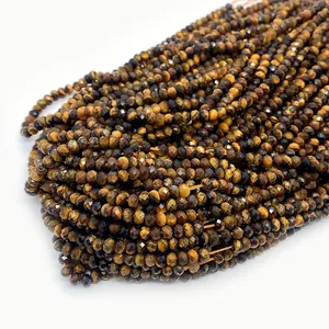 Macro view of faceted natural tiger eye beads showing unique golden brown textures