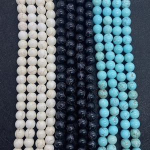 Macro view of natural turquoise, marble, and lava stone beads for DIY jewelry making