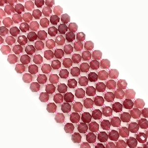 Macro view of faceted natural rose quartz beads for DIY jewelry making and necklace crafts
