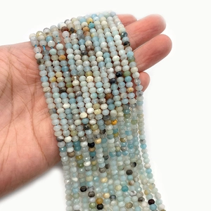 Cuentas de piedra natural tallada en azul y gris para joyería artesanal