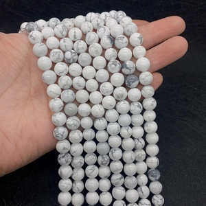 Detailed view of 8-10mm white howlite beads with natural gray marble texture for DIY jewelry