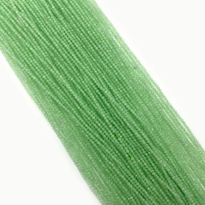 Macro shot of 2mm light green faceted natural stone beads for DIY jewelry making