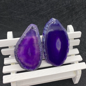 Macro detail of natural purple agate stone slices with raw edges for DIY jewelry making