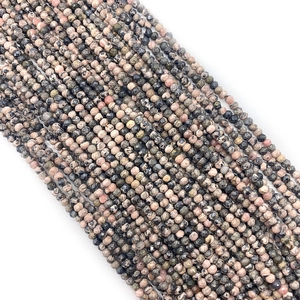 Macro shot of faceted natural pink and black stone beads for DIY jewelry making