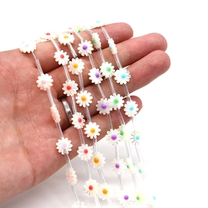 Daisy shaped beads made of natural shell and colorful acrylic for DIY jewelry making