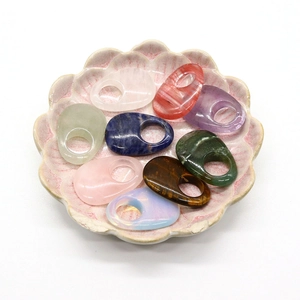 Mixed natural gemstone crystal oval rings set in a pink lotus ceramic decorative plate