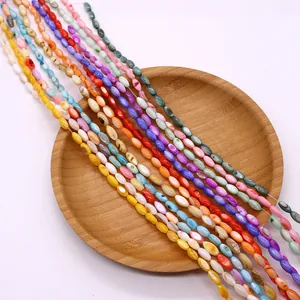Cuentas de concha natural pulida en varios colores vibrantes para hacer joyería DIY